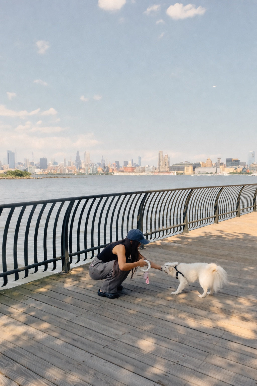 Lunara Pets founder sharing a quiet moment with her dog by the waterfront